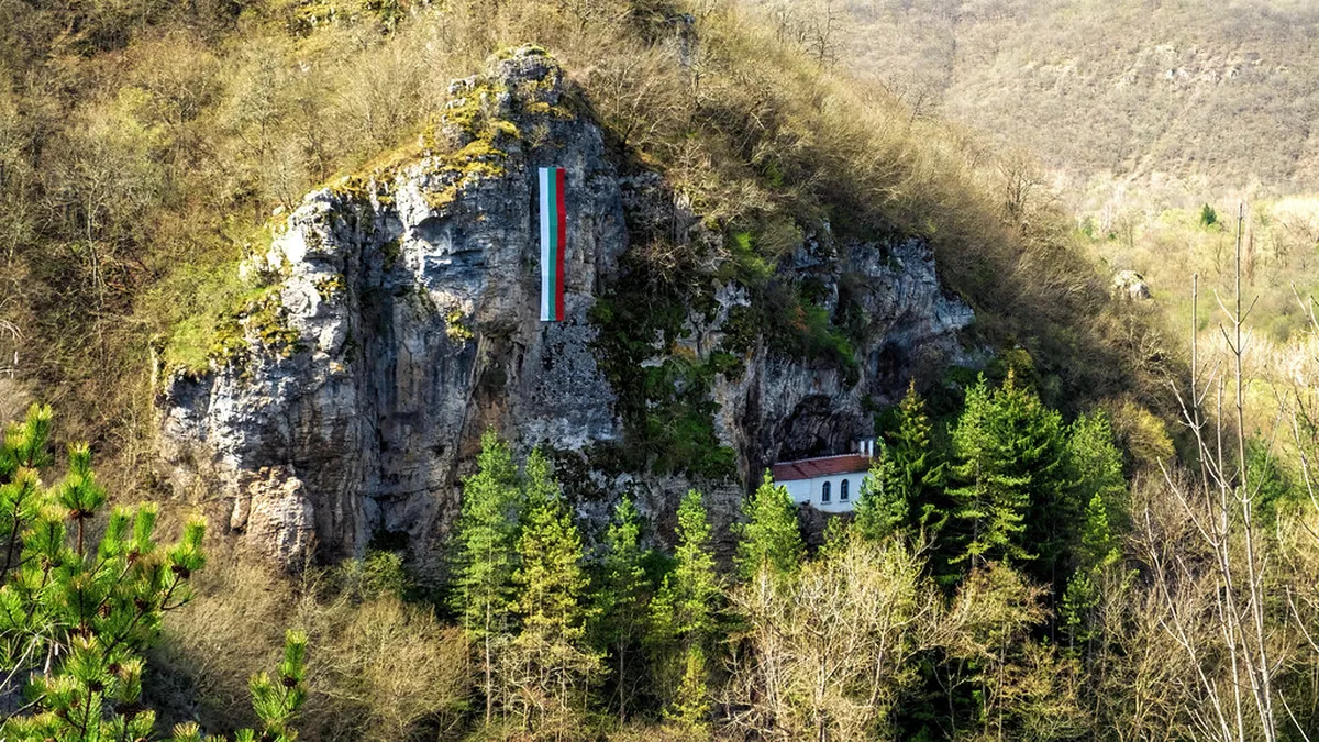 Rock-hewn cells and passages carved into the limestone cliff face at Aladzha Monastery