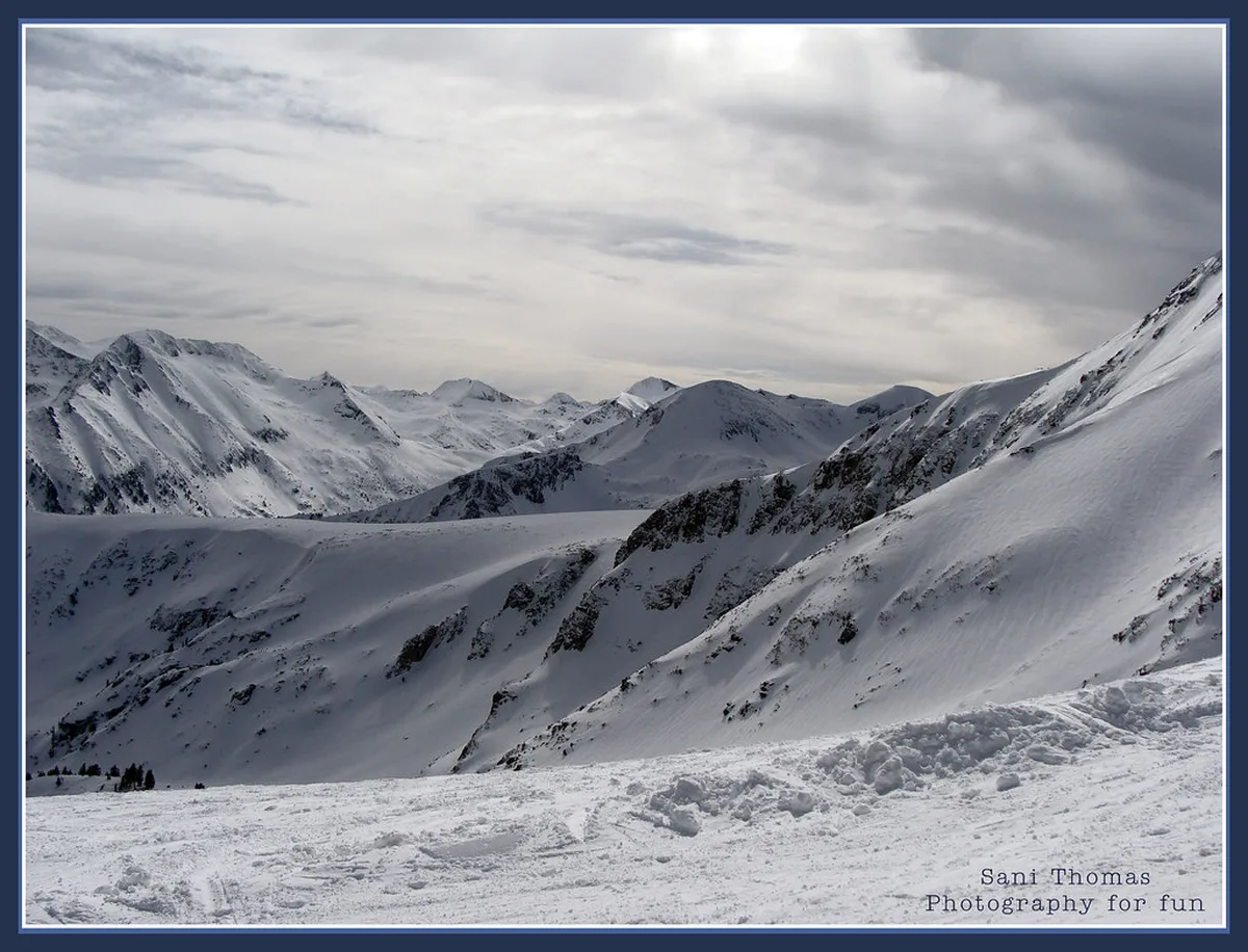 Snow-covered Pirin Mountains above Bansko, where peak temperatures and wind-chill demand careful packing