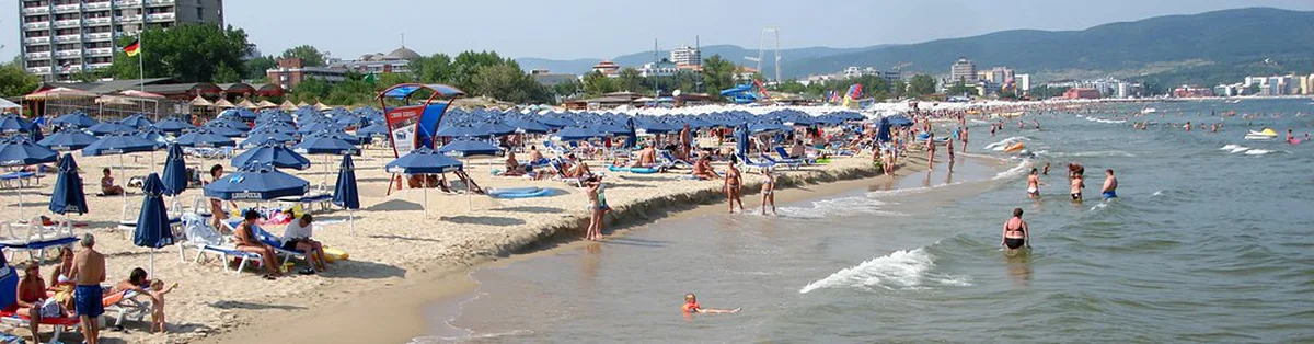 Golden sand beach on Bulgaria's Black Sea coast packed with summer sunbathers