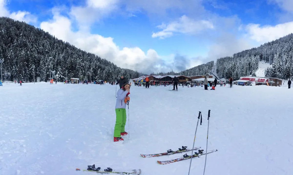 Snow-covered ski slopes and pine forest in the mountains above Bansko, Bulgaria